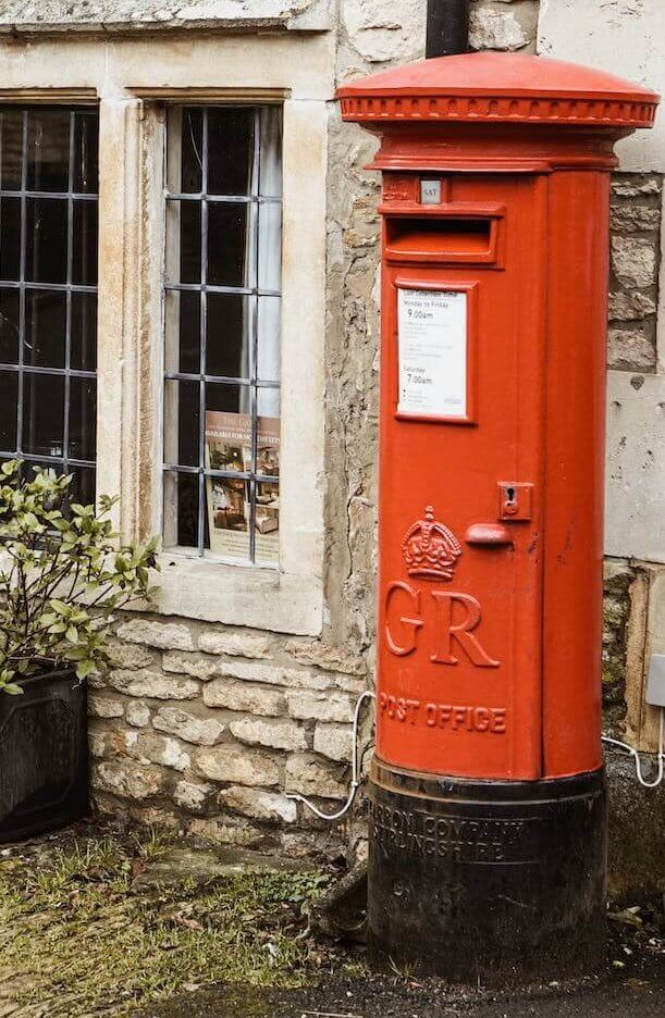red mailbox beside window